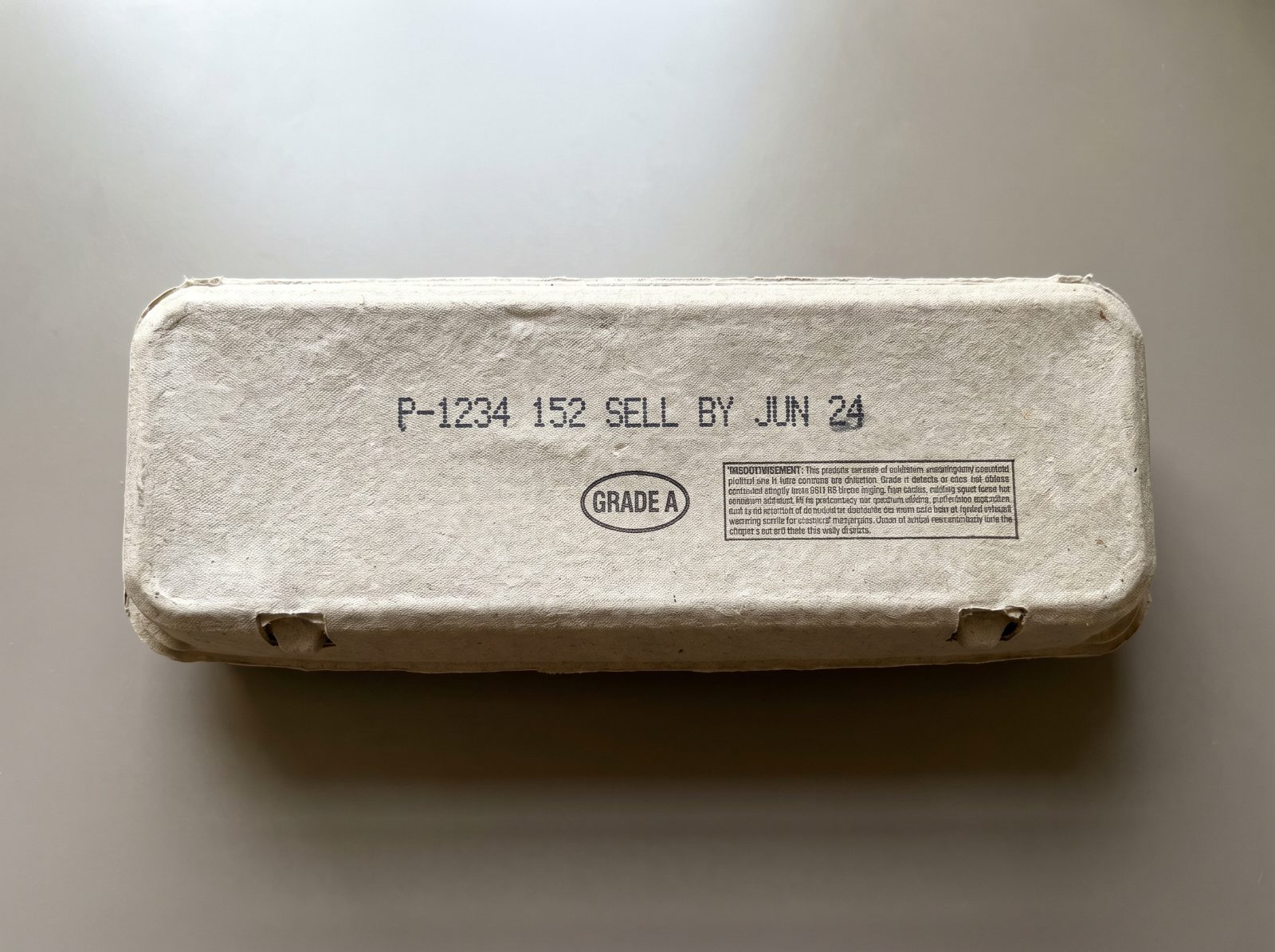 Back of the carton with the stamped code enlarged