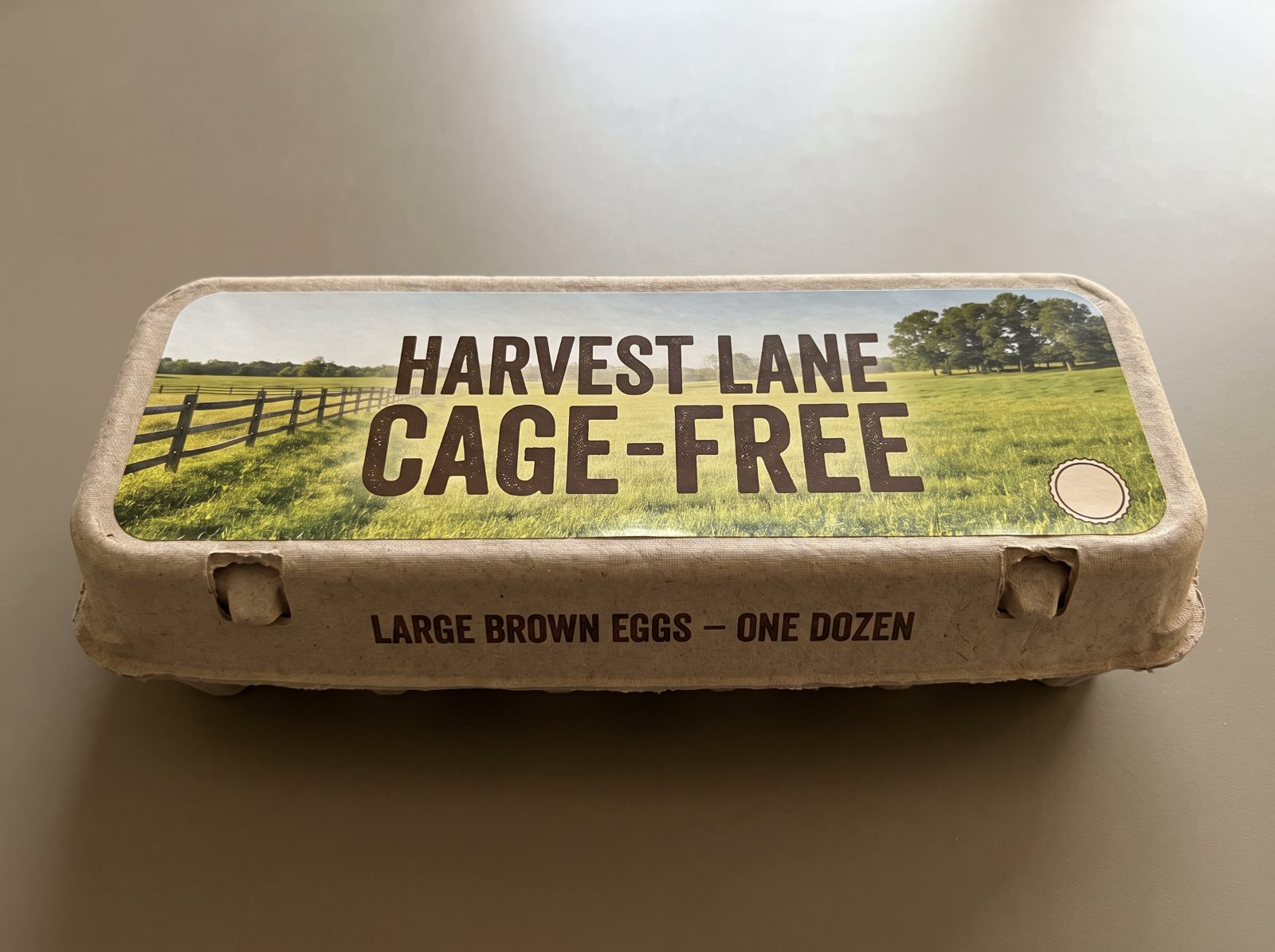Carton B, whose lid photograph shows a field, next to its cage-free claim